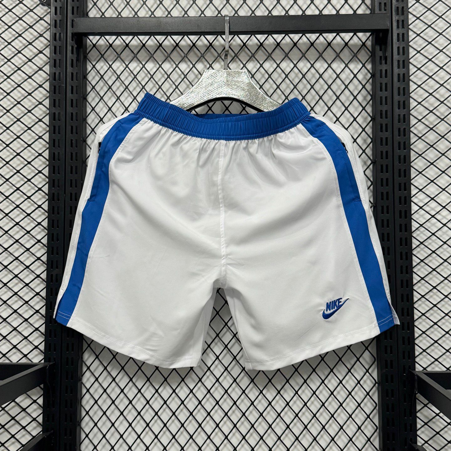 Nike club flow football shorts in white with blue side panels